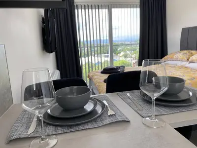a table with two wine glasses on top of it at Benollis in Oban