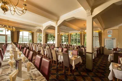a large dining room with tables and chairs at Loch Awe Hotel in Dalmally
