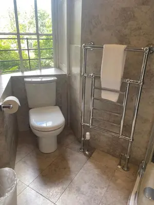 a bathroom with a toilet and a window at Private Guest Suite in Georgian Townhouse in City Centre in Edinburgh
