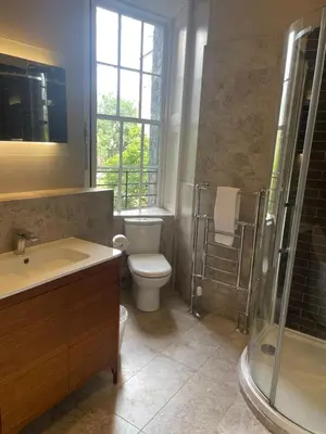 a bathroom with a toilet and a shower and a sink at Private Guest Suite in Georgian Townhouse in City Centre in Edinburgh