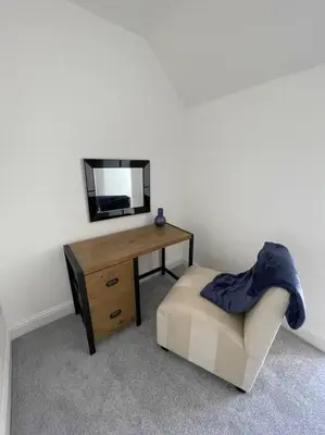 a room with a desk and a television and a chair at Fantastic home in Brightons, Falkirk. in Polmont