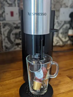 a coffee maker sitting on a counter with a cup at One The Mews in Glasgow