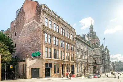 a large brick building on a city street at The Z Hotel Glasgow in Glasgow