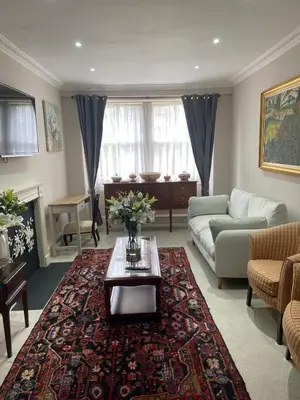 a living room with a couch and a coffee table at Merchiston Residence in Edinburgh