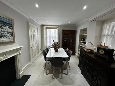 a dining room with a table and chairs at Merchiston Residence in Edinburgh