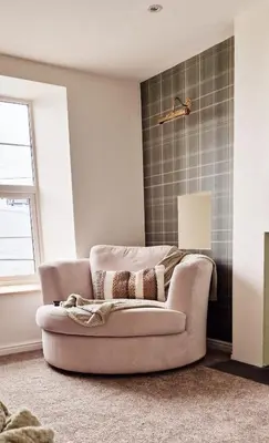 a living room with a couch in a room at Nordlys Cottage in Newton Stewart