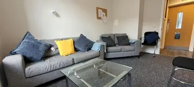 a living room with two couches and a coffee table at The Arches The Wee Yin in Stirling