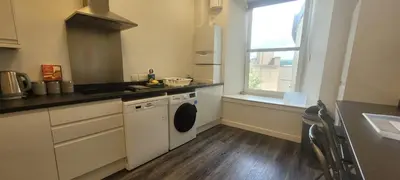 a kitchen with a sink and a dishwasher at The Arches The Wee Yin in Stirling