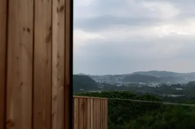 a view from a wooden building with a mountain view at The Black Cabin Oban in Oban