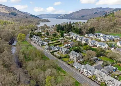 an aerial view of a town next to a lake at The Haven in Saint Fillans