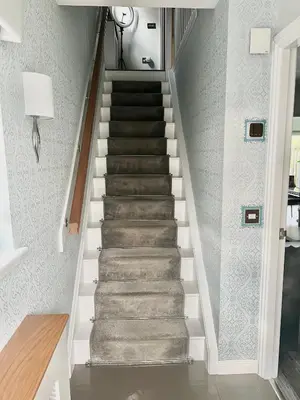 a staircase in a home with gray and white walls at Paradise on earth in Garthamlock