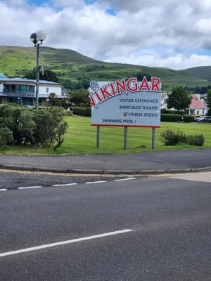 a sign on the side of a road next to a street at Apartment - Largs - Sleeps 4 - Pet Friendly in Largs