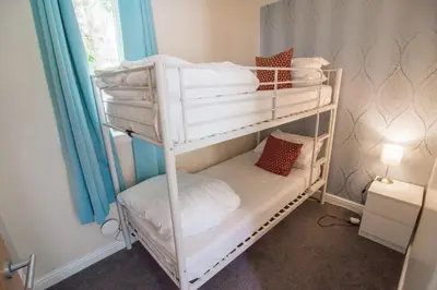 a couple of bunk beds in a room at Pheasant lodge - Balmaha 3 bed in Glasgow