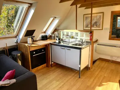 a small kitchen with a sink and a stove at Annexe Lodge cottage in Drymen in Drymen