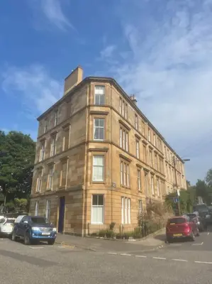 a large brick building on the side of a street at Stunning West End Flat! in Glasgow