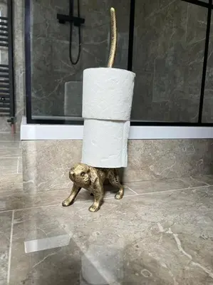 a dog with a roll of toilet paper on its back at Luxury Victorian spacious flat in Glasgow