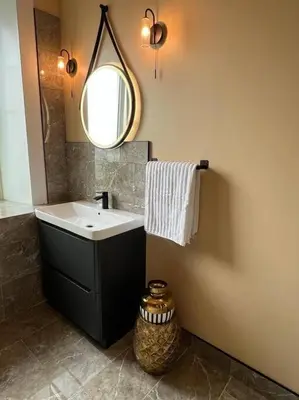 a bathroom with a sink and a mirror at Luxury Victorian spacious flat in Glasgow