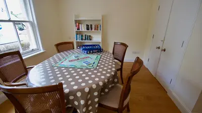 a dining room table with a polka dot table cloth at Fire Station Cottage in Comrie