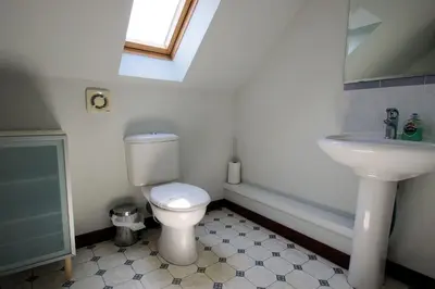 a bathroom with a toilet and a sink at Osprey View in Lochearnhead