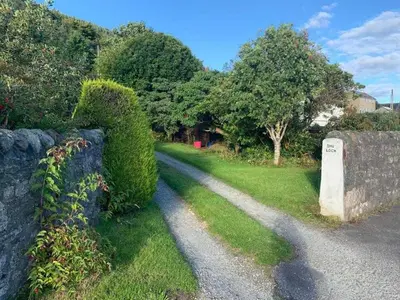 a bush shaped like the number eight next to a road at 2 Bed Cottage Sleeps 2 - Parking Pet Friendly in Dunoon