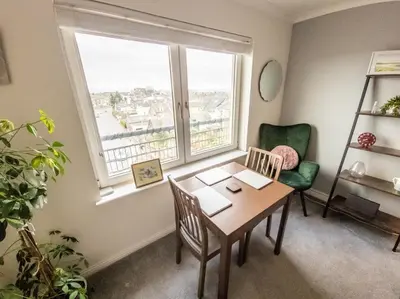 a dining room with a table and a window at Tranquil 2Bed/2Bath Duplex Falkirk in Falkirk