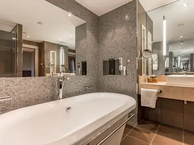 a large bathroom with a tub and a sink at Norton House Hotel & Spa, Edinburgh in Ingliston