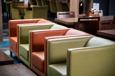 a row of empty chairs in a restaurant at Holiday Inn Express Edinburgh Airport by IHG in Ingliston