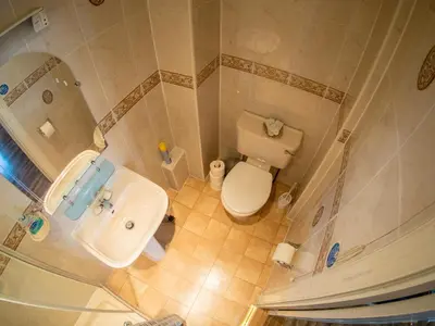 an overhead view of a bathroom with a toilet and a sink at Corstorphine Lodge Hotel in Edinburgh