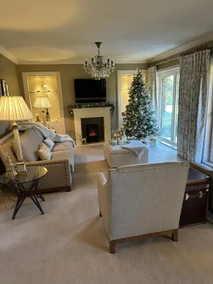 a living room with a christmas tree and a couch at One Dunbar Court Gleneagles Village in Auchterarder