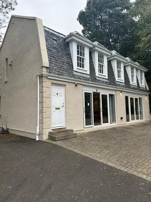 a large house with a white door and windows at Cameron Coach House Modern Property in Murrayfield Edinburgh in Edinburgh