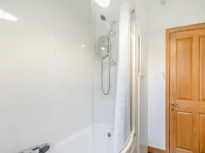 a shower stall in a bathroom with a tub at South Steading in West Kilbride