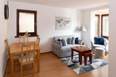 a living room with a couch and a table at Executive Apartment By Inverkeithing Train Station in Fife