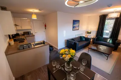 an aerial view of a kitchen and a living room at Dalwhinnie Apartment in Oban