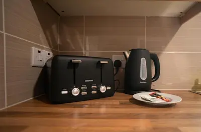 a toaster and coffee maker sitting on a counter at Darmeid House in Hartwood