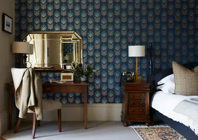 a bedroom with a bed and a mirror and a dresser at The Roseate Edinburgh - Small Luxury Hotels of the World in Edinburgh
