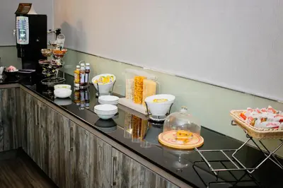 a counter in a restaurant with food on it at Albion Hotel in Glasgow