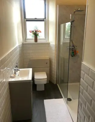 a bathroom with a toilet and a sink and a shower at CAMPBELL 100 DUNFERMLINE in Fife