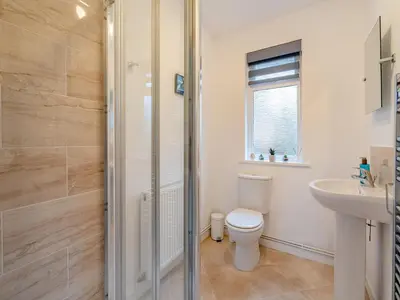 a bathroom with a toilet and a sink at Crarae in Corrie