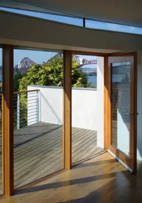 a house with a balcony with a view of the water at The Nook, Studio Apartment, South Queensferry in Queensferry