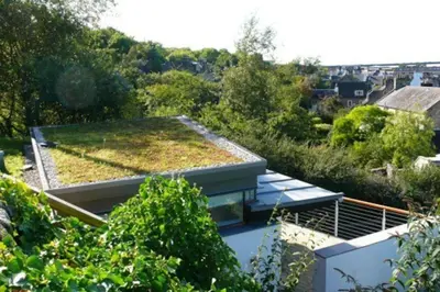 a house with a green roof on top of it at The Nook, Studio Apartment, South Queensferry in Queensferry