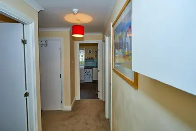 a hallway of a home with a red light at Little Bay View in Oban