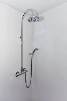 a shower with a shower head in a bathroom at Little Bay View in Oban