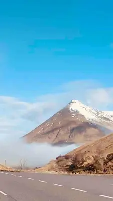 a mountain on the side of a road at Scottish Highland Cottage Tyndrum Upper Station in Crianlarich