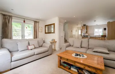 a living room with two couches and a coffee table at The Heathers in Killin