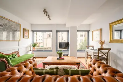 a living room with a couch and a table at The Riverside Hideaway by Calton Living in Edinburgh