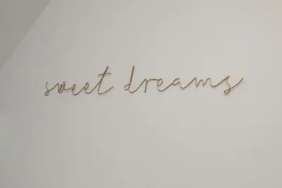 a sign with the words next trends written in cursive handwriting at Historical Holmehill Lodge in Dunblane