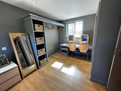 a dressing room with a desk and a mirror at Spacious 3-Bedroom Chalet on Country Estate near Glasgow - sleeps 6 in Glasgow