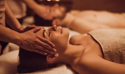 a woman getting a massage at a spa at Forest Corner Luxury Apartment with Hot Tub in North Ballachulish