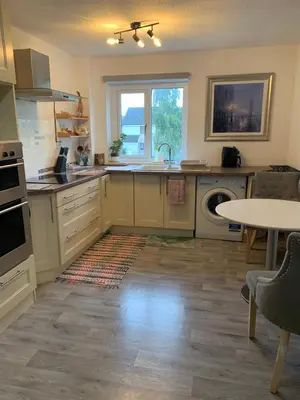 a kitchen with a sink and a dishwasher at Facing Glasgow Green spacious Apartment Free parking in Glasgow
