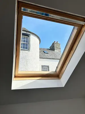 a window in a room with a view of a building at Luxury Smugglers Cottage in the Heart of Inveraray Sleeps 4 in 2 Bedrooms in Inveraray